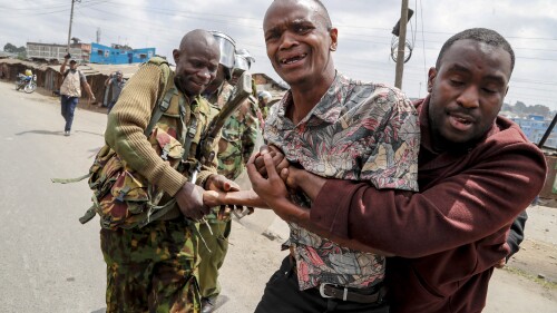 Police arrest a protester during clashes in the Mathare area of Nairobi, Kenya Wednesday, July 19, 2023. Kenyans were back protesting on the streets of the capital Wednesday against newly imposed taxes and the increased cost of living. (AP Photo/Brian Inganga)