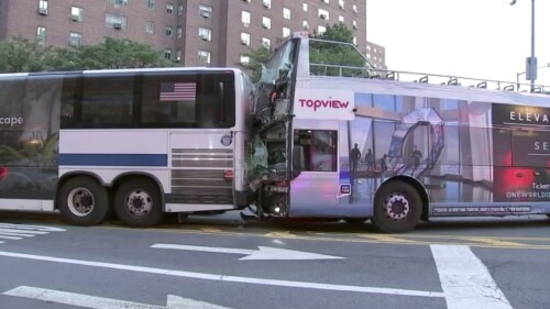 Two busses are damaged after a collision on Thursday, July 6, 2023 in New York. A crash involving a double-decker tour bus and a city bus in Manhattan sent several people to hospitals for treatment, fire and EMS officials said. (WABC via AP)