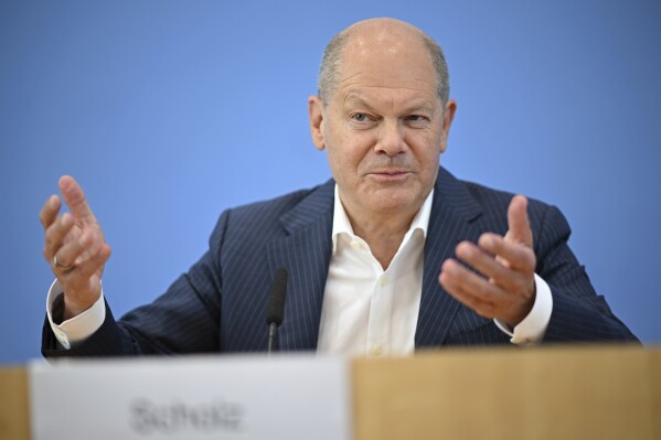 German Chancellor Olaf Scholz addresses the media during his summer press conference in Berlin, Germany, Wednesday, July 24, 2024. (Britta Pedersen/dpa via ĢӰԺ)