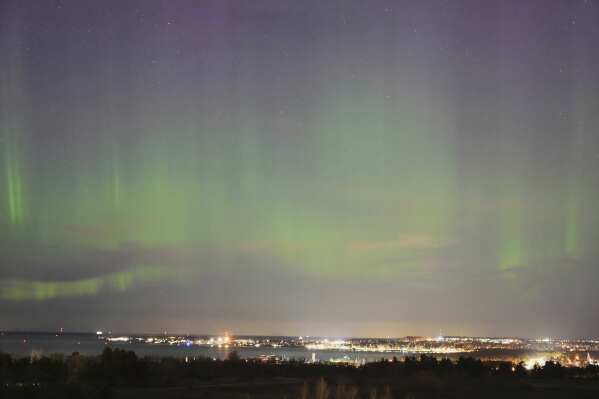 An aurora borealis, also known as the northern lights, is seen in the night sky over the Tallinn bay of the Baltic sea in Tallinn, Estonia, April 2, 2025. (AP Photo/Sergei Grits, file)