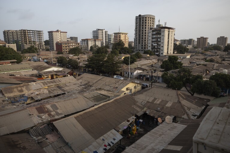 Buildings in Conakry, Guinea are seen on Wednesday, April 10, 2024. (AP Photo/Misper Apawu)