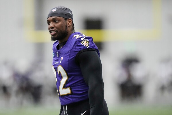 Baltimore Ravens running back Derrick Henry (22) works out during an NFL football practice, May 28, 2025, at the Under Armour Performance Center in Owings Mills, Md. (AP Photo/Stephanie Scarbrough, File)