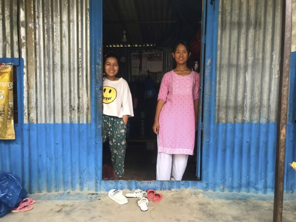 Khendo Tamang, right, Nirmala Pariyar will take a photo at his Nirmala home in Kathmandu, Nepal on October 15th, 2023.
