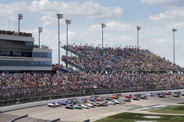 FILE - Drivers pass the grandstand at the start of the NASCAR Xfinity Series auto race, Saturday, July 29, 2017, at Iowa Speedway in Newton, Iowa. Iowa Speedway, which opened in 2006, gets its long awaited NASCAR Cup Series race on Sunday, June 16, 2024. (AP Photo/Charlie Neibergall, File)