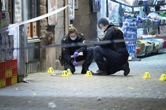 FILE - In this photo taken late Saturday, Nov. 9, 2019, police officers work near the scene of a shooting, in Malmo, Sweden. A 13-year-old boy from the suburbs of Stockholm who was found dead in the woods near his home earlier this month, was the latest victim of a deadly gang war in Sweden where the group, warring over arms and drug trafficking, reportedly are recruiting children. (Johan Nilsson/TT News Agency via AP, File)