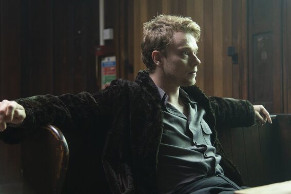 This image released by IFC Films shows Alfie Allen in a scene from the comedy "How to Build a Girl."  (Sven Arnstein/IFC Films via AP)