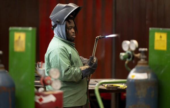 K'Jan Mason, a student of Hendry County Adult Learning participating in the welding program checks the torch prior to a welding project on Thursday, March 14 ,2024. The program helps adults gain the necessary experience to receive certification and immediately enter the local workforce after completion in Clewiston, Fla. (AP Photo/Chris Tilley)