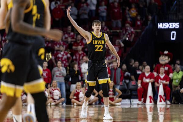 Iowa's Patrick McCaffery (22) celebrates after his 3-point basket against Nebraska in the first half during an NCAA college basketball game Thursday, Dec. 29, 2022, in Lincoln, Neb. (AP Photo/John Peterson)