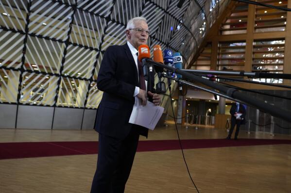 European Union foreign policy chief Josep Borrell speaks with the media as he arrives for a meeting of EU foreign ministers in Brussels, Monday, Feb. 21, 2022. The European Union's top diplomat, foreign policy chief Josep Borrell, welcomed the prospect of a summit but said that should diplomacy fail the 27-nation has finalized its package of sanctions for use if Putin orders an invasion. (AP Photo/Virginia Mayo)