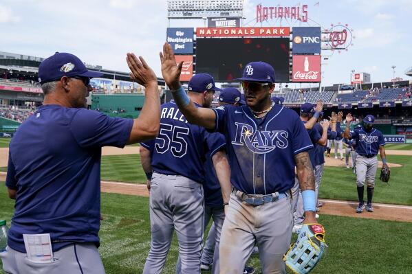 Tampa Bay Rays manager Kevin Cash, left, celebrates with Jose Siri after a baseball game against the Washington Nationals at Nationals Park, Wednesday, April 5, 2023, in Washington. The Rays won 7-2. (AP Photo/Alex Brandon)