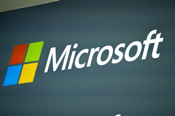FILE - The Microsoft logo in the Mobile World Congress 2023 in Barcelona, Spain, on March 2, 2023. (AP Photo/Joan Mateu Parra, File)