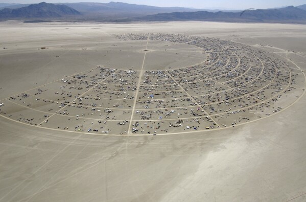 Black Rocky City begins to grow during the opening of Burning Man Sunday, Aug. 27, 2006, in Gerlach, Nev.  (AP Photo/Ron Lewis, File)