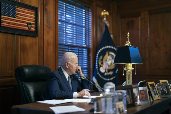FILE - In this file image provided by The White House, President Joe Biden speaks with Russian President Vladimir Putin on the phone from his private residence in Wilmington, Del., Dec. 30, 2021. Biden acknowledged on Thursday that a document with classified markings from his time as vice president was found in his “personal library” at his home in Wilmington, Delaware, along with other documents found in his garage, days after it was disclosed that sensitive documents were also found at the office of his former institute in Washington. (Adam Schultz/The White House via AP, File)