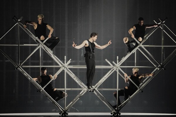 Theo Evan from Cyprus performs the song "Shh" during the first semi-final of the 69th Eurovision Song Contest, in Basel, Switzerland, Tuesday, May 13, 2025. (AP Photo/Martin Meissner)