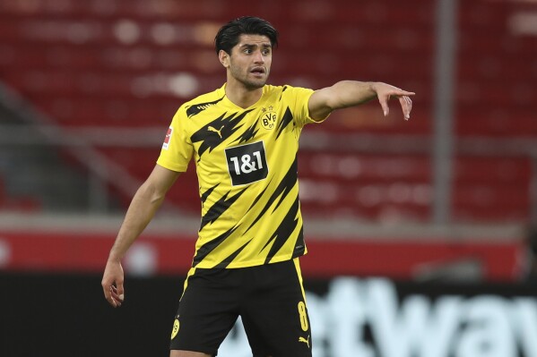 FILE - Dortmund's Mahmoud Dahoud gestures during the German Bundesliga soccer match between Stuttgart and Dortmund at the Mercedes-Benz Arena stadium in Stuttgart, Germany, on April 10, 2021. Dahoud is signing for Brighton on a free transfer after Borussia Dortmund allowed his contract to expire. Brighton said Friday June 16, 2023 that the 27-year-old joins on a four-year contract after his Dortmund contract ends June 30. (Tom Weller/Pool via AP, File)