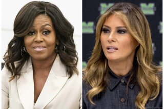 This combination photo shows former first lady Michelle Obama, left, and current first lady Melania Trump. The website NowThis has attracted attention with videos that illustrate inconsistencies by Fox News personalities, like one posted Tuesday, July 23, 2019, that contrasts the news network’s treatment of Obama and Trump. (AP Photo)
