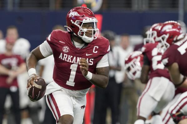 Arkansas quarterback KJ Jefferson scrambles out of the pocket before throwing a pass in the second half of an NCAA college football game against Texas A&M in Arlington, Texas, Saturday, Sept. 25, 2021. (AP Photo/Tony Gutierrez)