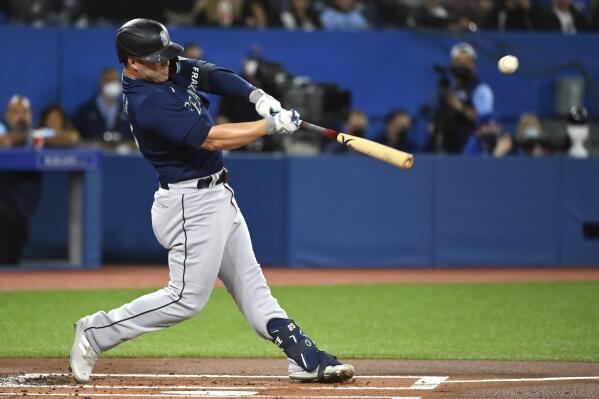 Seattle Mariners' Ty France hits a single during the first inning of a baseball game against the Toronto Blue Jays in Toronto on Wednesday, May 18, 2022. (Jon Blacker/The Canadian Press via AP)