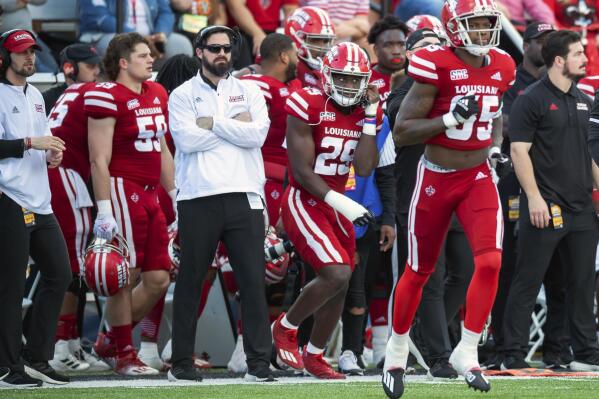 Louisiana-Lafayette co-offensive coordinator and tight ends coach Michael Desormeaux stands on the sideline during an NCAA college football game against Appalachian State in the SBC Championship game at Cajun Field, Saturday, Dec. 4, 2021, in Lafayette, La. No. 16 Louisiana-Lafayette promoted co-offensive coordinator and former Ragin' Cajuns quarterback Michael Desormeaux to head coach on Sunday, Dec. 5. (Scott Clause/The Daily Advertiser via AP)