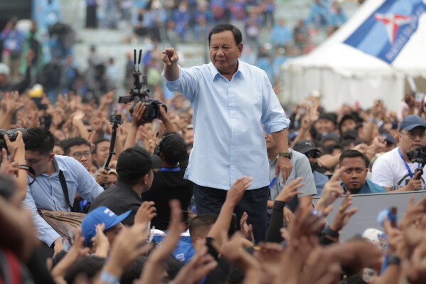 FILE - Indonesian presidential candidate Prabowo Subianto greets supporters during his campaign rally in Malang, East Java, Indonesia Thursday, Feb. 1, 2024. Indonesians on Wednesday, Feb. 14, 2024 will elect the successor to popular President Joko Widodo, who is serving his second and final term. It is a three-way race for the presidency among current Defense Minister Prabowo Subianto and two former governors, Anies Baswedan and Ganjar Pranowo. (APPhoto/Trisnadi, File)