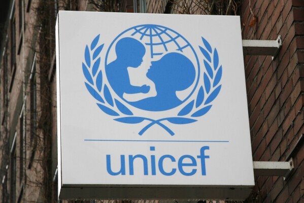 FILE - The UNICEF logo is seen at the German UNICEF headquarters in Cologne, Germany, on Feb. 5, 2008. Over 230 million women and girls have undergone female genital mutilation, most of whom live in Africa, according to a report issued on Friday, March 8, 2024, by the United Nations children's agency. (AP Photo/Hermann J. Knippertz, File)