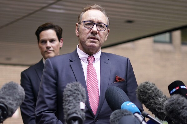 FILE - Actor Kevin Spacey addresses the media outside Southwark Crown Court in London, Wednesday, July 26, 2023. Spacey, the Oscar-winning actor, has denied new allegations of inappropriate behavior from men who will feature in a documentary on British television that is due to be released on May, 6-7, 2024. (AP Photo/Alberto Pezzali, File)