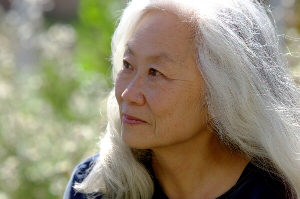 FILE - Author Maxine Hong Kingston appears in the backyard of her Oakland, Calif. home on April 10, 2001. Kingston, the Chinese-American author best known for 