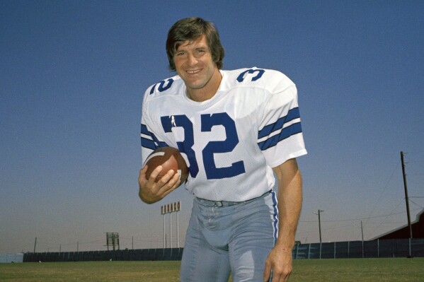 FILE - Walt Garrison, running back for the Dallas Cowboys, is shown in this 1974 photo. Walt Garrison, who led the Big 8 in rushing as an Oklahoma State Cowboy, won a Super Bowl with the Dallas Cowboys, and in the NFL offseason competed as a rodeo cowboy, has died. He was 79. The NFL team said in a story posted on its website Thursday, Oct. 12, 2023, that Garrison died overnight. (AP Photo/File)