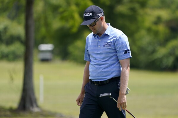 FILE - Russell Knox, of Scotland, reacts to his putt on the first green during the final round of the PGA Zurich Classic golf tournament at TPC Louisiana in Avondale, La., Sunday, April 24, 2022. Knox has limited status on the PGA Tour next year and doesn't know how the new schedule will affect how often he gets to play. (AP Photo/Gerald Herbert, File)