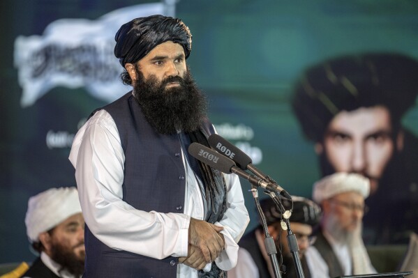 FILE - Afghan Taliban's Acting Minister of Interior Sirajuddin Haqqani speaks during a ceremony in Kabul,, Afghanistan, May 11, 2023. Messages by two influential Taliban leaders in Afghanistan this week showed tensions between hardliners and more moderate elements who want to scrap harsher policies and attract more outside support, experts said Thursday, April 11, 2024. (AP Photo/Ebrahim Noroozi, file)