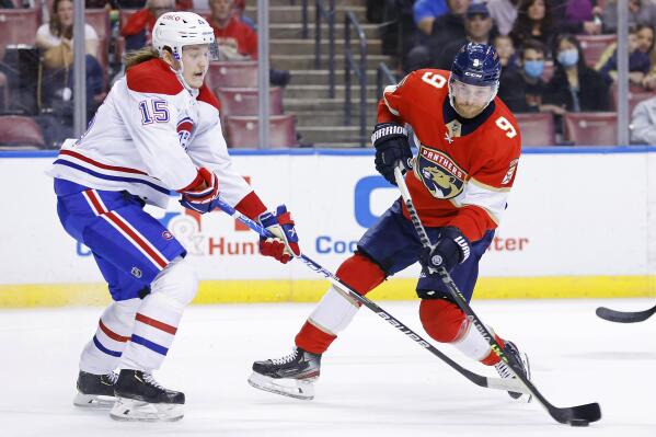 Florida Panthers center Sam Bennett (9) takes a shot on goal against the Montreal Canadiens during the first period of an NHL hockey game, Saturday, Jan. 1, 2022, in Sunrise, Fla. (AP Photo/Michael Reaves)
