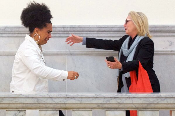 
              Bill Cosby accusers Lili Bernard, left, and Victoria Valentino, right, reach out to embrace outside the courtroom after Cosby was found guilty in his sexual assault retrial, Thursday, April, 26, 2018, at the Montgomery County Courthouse in Norristown, Pa. A jury convicted the "Cosby Show" star of three counts of aggravated indecent assault on Thursday. The guilty verdict came less than a year after another jury deadlocked on the charges.  (Mark Makela/Pool Photo via AP)
            