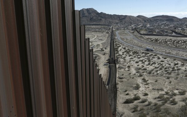 
              FILE - In this Wednesday, Jan. 25, 2017 file photo, a truck drives near the Mexico-US border fence, on the Mexican side, separating the towns of Anapra, Mexico and Sunland Park, New Mexico. A third of the U.S.-Mexico border is already studded with an assortment of fences. But closing off the rest will be no easy task. Much of the border through Texas is blocked by the Rio Grande or other natural barriers. Most all the Texas border land is private, and many landowners oppose the plan. (AP Photo/Christian Torres, File)
            