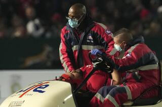 Wales' Tomas Francis is taken off the field after he caught the knee of South Africa's Steven Kitshoff during the Rugby Championship test at Loftus Versfeld Stadium in Pretoria, South Africa, Saturday, July 2, 2022. (AP Photo/Themba Hadebe)