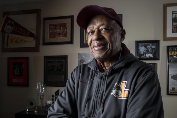 Former Loyola NCAA college basketball star Jerry Harkness poses at his home in Indianapolis on Wednesday, March 7, 2018. Harkness, who led Loyola Chicago to a barrier-breaking national basketball championship and a was civil rights pioneer, has died. He was 81. The school announced Harkness passed away Tuesday morning, Aug. 24, 2021. (Zbigniew Bzdak/Chicago Tribune via AP)