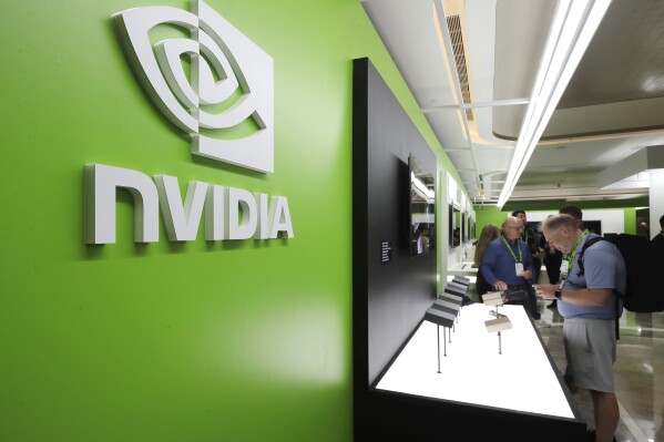 People take a look to Nvidia''s new products during the Computex 2025 exhibition in Taipei, Taiwan, Wednesday, May 21, 2025. (AP Photo/Chiang Ying-ying, File)