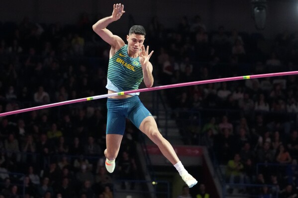 FILE - Thiago Braz, of Brazil, makes an attempt in in the Men's pole vault at the World Athletics Indoor Championships in Belgrade, Serbia, on March 20, 2022. Olympic pole vault gold medalist Thiago Braz has been banned for 16 months for doping and will miss the Paris Games. Track and field’s Athletics Integrity Unit announced the verdict Tuesday, May 28, 2024. Braz won the Olympic title at his home Rio de Janeiro Olympics in 2016 and took bronze in Tokyo three years ago. (AP Photo/Darko Vojinovic, File)