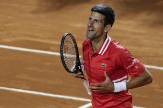 FILE - Serbia's Novak Djokovic celebrates after defeating Italy's Lorenzo Sonego in their semifinal match at the Italian Open tennis tournament, in Rome, May 15, 2021. Djokovic won 6-3 6-7 6-2 and will play Rafael Nadal in the final. Novak Djokovic is ready to move on from the controversy surrounding his refusal to get vaccinated against COVID-19.
“I miss competition,” the Serbian tennis star said Sunday April 10, 2022, on the opening day of the clay-court season at the Monte Carlo Masters in Monaco. (AP Photo/Gregorio Borgia, File)