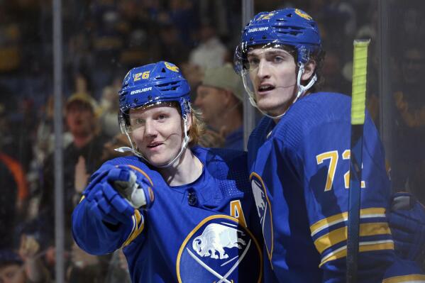 Buffalo Sabres defenseman Rasmus Dahlin (26) and right wing Tage Thompson (72) celebrate a goal by Dahlin during the second period of an NHL hockey game against the Philadelphia Flyers on Saturday, April. 16, 2022, in Buffalo, N.Y. (AP Photo/Joshua Bessex)