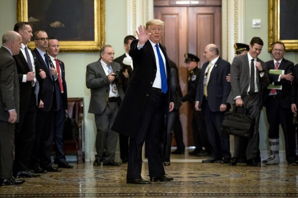 
              President Donald Trump speaks to members of the media as he departs a Senate Republican policy lunch on Capitol Hill in Washington, Tuesday, March 26, 2019. (AP Photo/Andrew Harnik)
            