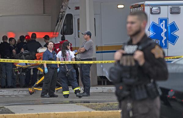 Emergency personnel gather after a deadly shooting Sunday, July 17, 2022, at the Greenwood Park Mall, in Greenwood, Ind. (Kelly Wilkinson/The Indianapolis Star via AP)