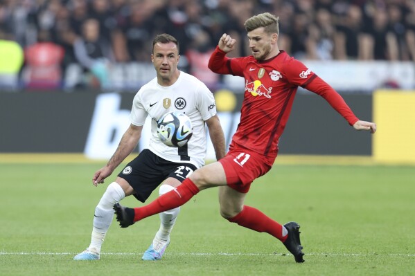 FILE - Leipzig's Timo Werner, right, challenges for the ball with Frankfurt's Mario Goetze during the German soccer cup, DFB Pokal, final match between RB Leipzig and Eintracht Frankfurt at Olympiastadion in Berlin, Germany, Saturday, June 3, 2023. Werner might have won the Champions League during his time with Chelsea from 2020-22 but it was still an underwhelming stint in English soccer for the Germany forward. It looks like he'll be returning to England — to London again, too — in a bid to ignite his career ahead of the European Championship. (AP Photo/Andreas Gora, File)