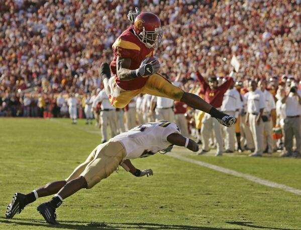 USC's Reggie Bush, Tebow make College Football Hall of Fame | AP News