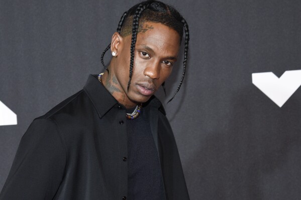 FILE - Travis Scott arrives at the MTV Video Music Awards at Barclays Center on Sept. 12, 2021, in New York. Scott released his first album in five years on Friday, the 19 track “Utopia.