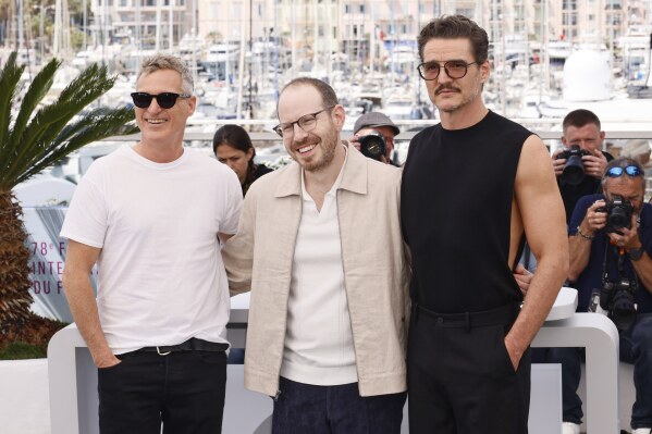 Joaquin Phoenix, from left, director Ari Aster and Pedro Pascal Pose for photographers at the photo Call for the Film 'Eddington' at the 78th International Film Festival, Cannes, southern France, Saturday, May 17, 2025. (Photo by Joel C Ryan/Invision/AP)