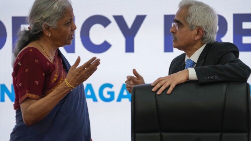 Indian Finance Minister Nirmala Sitharaman, left and Reserve Bank of India governor Shaktikanta Das, talk as they arrive to address the media after a meeting of finance chiefs and central bank governors of the Group of 20 leading economies in Gandhinagar, India, Tuesday, July 18, 2023. (AP Photo/Ajit Solanki)