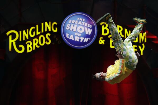 FILE - A Ringling Bros. and Barnum & Bailey clown does a somersault during a performance Saturday, Jan. 14, 2017, in Orlando, Fla. Four years after the “Greatest Show On Earth" shut down, officials are planning to bring back the The Ringling Bros. and Barnum & Bailey Circus. But animals will no longer be featured in their shows. A spokesperson for Florida-based Feld Entertainment says an announcement is expected sometime next year. The three-ring circus shut down in May 2017 after a 146-year run. (AP Photo/Chris O'Meara, file)