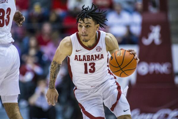 Alabama guard Jahvon Quinerly (13) works inside against South Carolina during the second half of an NCAA college basketball game, Saturday, Feb. 26, 2022, in Tuscaloosa, Ala. (AP Photo/Vasha Hunt)