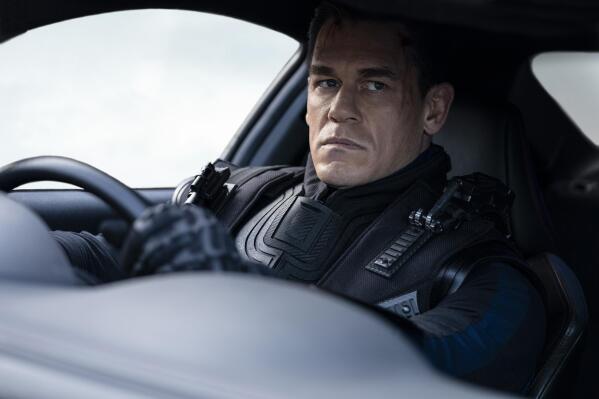 This image released by Universal Pictures shows John Cena in a scene from "F9: The Fast Saga." (Giles Keyte/Universal Pictures via AP)