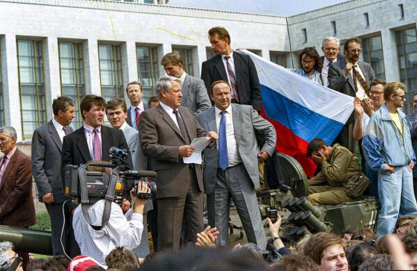 FILE In this Monday, Aug. 19, 1991 file photo, Boris Yeltsin, President of the Russian Federation, makes a speech from atop a tank in front of the Russian parliament building in Moscow, Russia. In the capital, where thousands of protesters confronted soldiers on tanks and armed personnel carriers, Yeltsin climbed atop one military vehicle and urged the Russian people to fight back with an immediate general strike. (AP Photo, File)